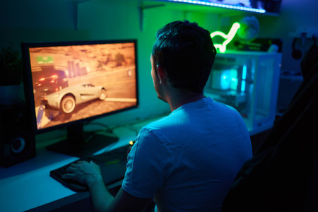 Player looking at his computer screen, contemplating his next move in an online video game.