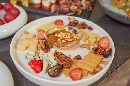 Different kind of cheese with wine, figs, walnuts, jamon.の写真素材