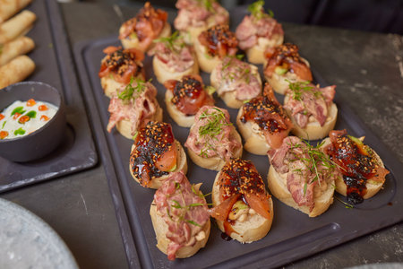 Different types of canapes on buffet table.の写真素材