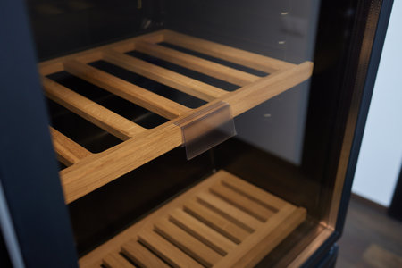 Empty Wine fridge in a kitchen home rack.の写真素材