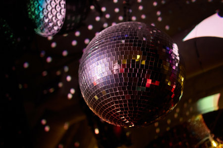 Colorful disco mirror ball lights night club background.の写真素材