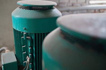 Close-up at pipeline valve which is using to control production process in the oil refinery plant. Selective focus at the valve handle wheel, Heavy industrial object photo.の写真素材
