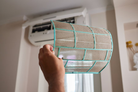 Dirty air conditioner filter need cleaning. Air conditioner service, repair and clean equipment.の写真素材
