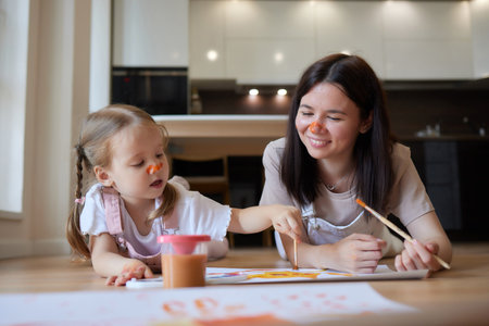 Little girl and their mother playing on warm floor with underfloor heating in living room. watercolor painting.の写真素材