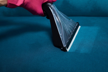 Dirty sofa chemical cleaning with professionally extraction method. Upholstered furniture. Early spring cleaning or regular clean up.の写真素材