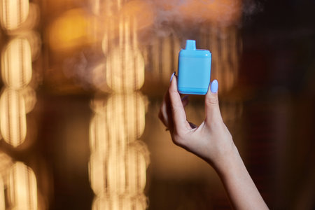 middle aged woman is exhaling vape smoke.