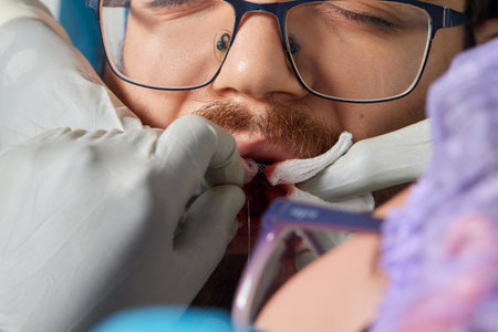 tongue splitting. cutting the tongue, one type of modification of the human body. surgery concept.の写真素材