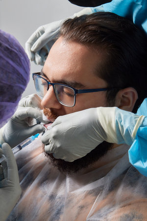 tongue splitting. cutting the tongue, one type of modification of the human body. surgery concept.
