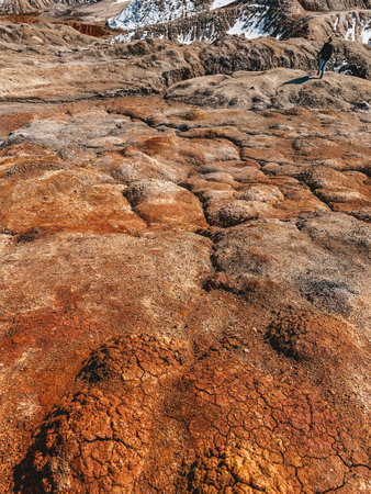 Clay Open Quarry Mars Landscape with Orange Water. Abandoned Rock Texture Old Porcelain Pit Mine in Ural. Erosion Crack Hill Desert Surface.の写真素材