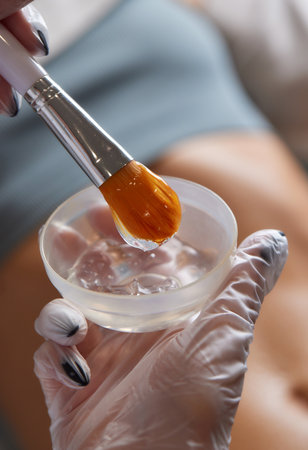 procedure removing cellulite on female abdomen, cavitation belly massage. Ultrasonic massage for weight loss. Correction of female figure without surgical intervention. Closeup of the tummy.の写真素材