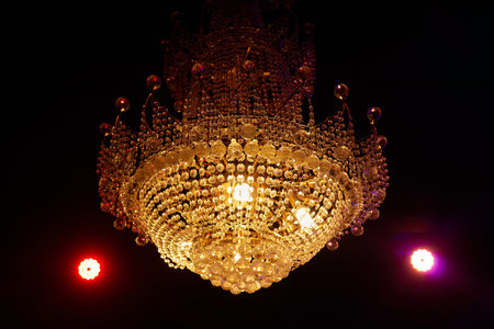 Close-up of a beautiful crystal chandelier Beautiful chandelier. luxury expensive chandelier hanging under ceiling.の写真素材