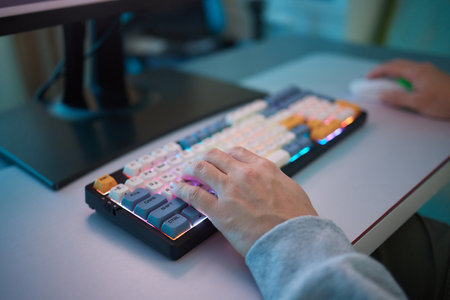 Player looking at his computer screen, contemplating his next move in an online video game.の写真素材