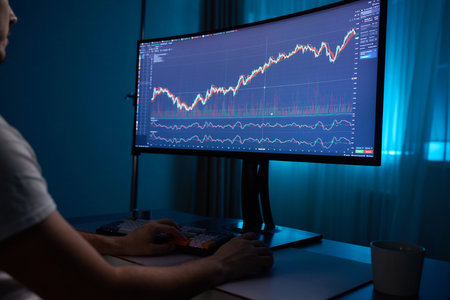Focused business man trader analyst looking at computer monitor, investor broker analyzing indexes