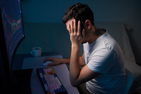 Focused business man trader analyst looking at computer monitor, investor broker analyzing indexes