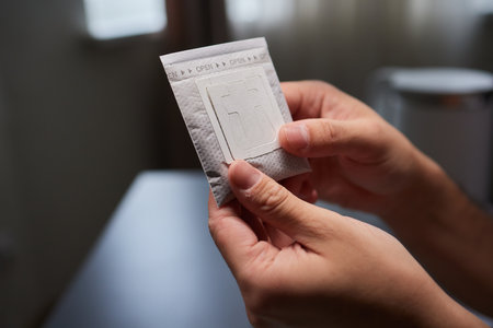 brewing process,a bag filled with boiling water for drip coffee in a cup,top view.の写真素材