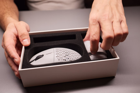 white new wireless computer mouse flat lay with led lights