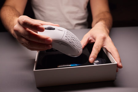 white new wireless computer mouse flat lay with led lightsの写真素材