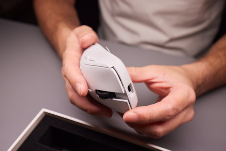 white new wireless computer mouse flat lay with led lights