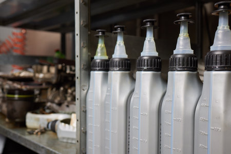 Gray plastic canister machine lubricating oil gallon bottle 4 liters with a blue cap for machine engine carの写真素材