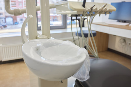 Modern dental practice. Dental chair and other accessories used by dentists in blue, medic lightの写真素材
