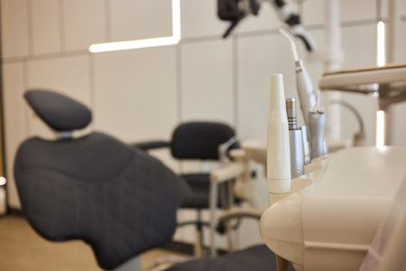 Modern dental practice. Dental chair and other accessories used by dentists in blue, medic lightの写真素材