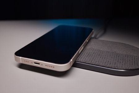 smartphone wireless charging on induction charger. Wireless charger