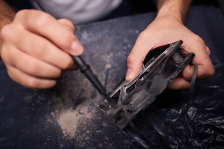 Cleaning a processor fan with a brushの写真素材