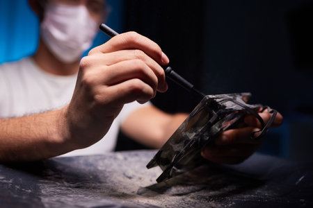 Cleaning a processor fan with a brushの写真素材