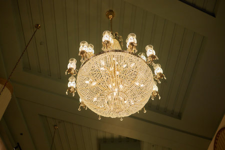 Close-up of a beautiful crystal chandelier Beautiful chandelier. luxury expensive chandelier hanging under ceiling.の写真素材