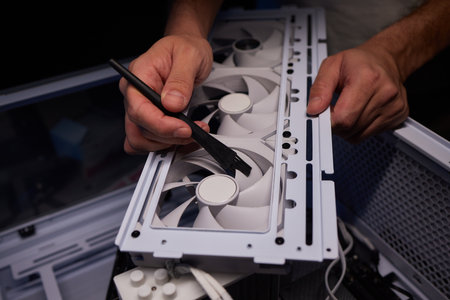 Cleaning a processor fan with a brush