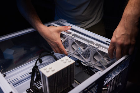 Cleaning a processor fan with a brushの写真素材