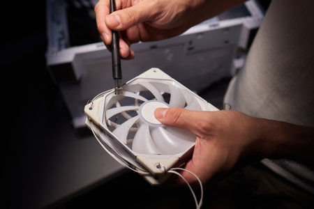 Cleaning a processor fan with a brush