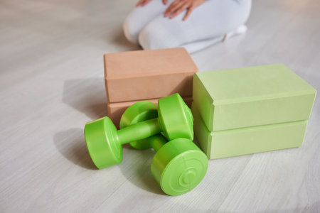 Empty, bright Yoga studio with mats and foam blocks. Wooden floor.の写真素材
