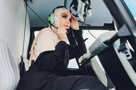 Elegant business muslim arab woman near the helicopter. Business, success and luxury concept.
