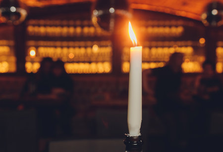 candles burning in a restaurant close up.の写真素材