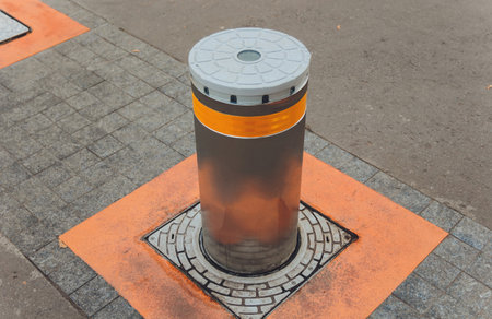 closeup of automatic car parking extending pillar, barrier at pedestrian only zone bridge, sidewalk....