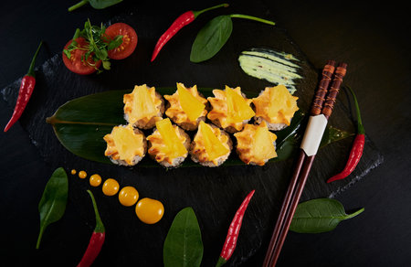 Traditional Japanese food - sushi, rolls and sauce on a black background. Top view.の写真素材