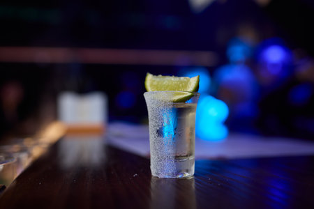 Enjoying Refreshing Beverages with Lime Slices in a Fun and Lively Social Settingの写真素材
