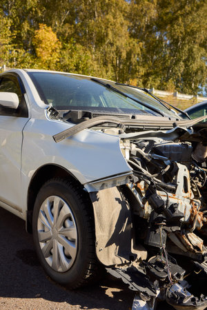 Severe Car Crash Damage Completely Wrecked Vehicles After a Major Collision Incidentの写真素材
