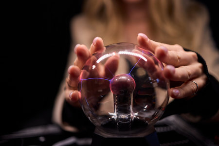 Engaging with a Plasma Ball A Truly Fascinating and Scientific Display of Electricityの写真素材