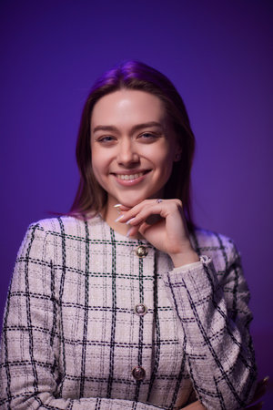 Young beautiful smart woman over purple isolated background happy face smiling Positive person.の写真素材