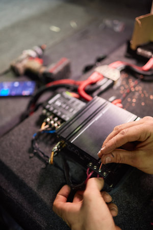 Technician installing the car audio processor Car audio installation concept.の写真素材