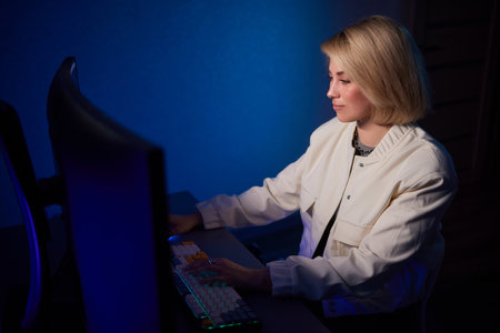Beautiful Female Video Editor Works with Footage on Her Personal Computer, She Works in Creative...