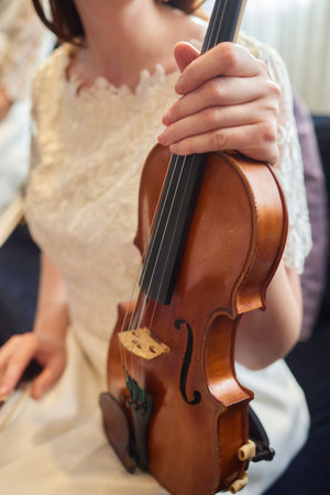 A cellist skillfully plays the cello, focused and immersed in the musicの写真素材