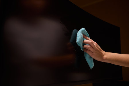 Effective and Safe Cleaning Techniques for a Curved Television Screen Using a Microfiber Cloth