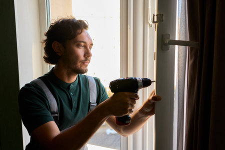 Home Improvement Installing a Window with the Use of Power Tools for Better Efficiencyの写真素材