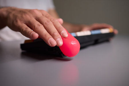 Clean your keyboard easily with a gel cleaner, an efficient solution for a dustfree workspace