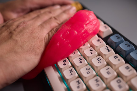 Clean your keyboard easily with a gel cleaner, an efficient solution for a dustfree workspaceの写真素材