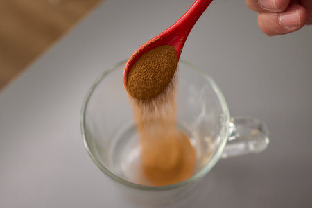 In the morning, a spoon is essential for scooping coffee from a jar, creating a comforting routineの写真素材