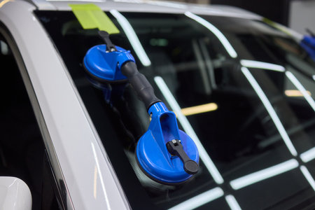 Installing windshield on a car with automotive designの写真素材